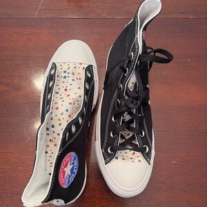 High top converse shoes.